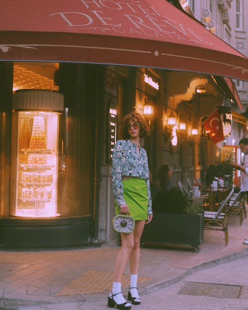 Young Woman in a Retro Outfit Standing on the Street in City 