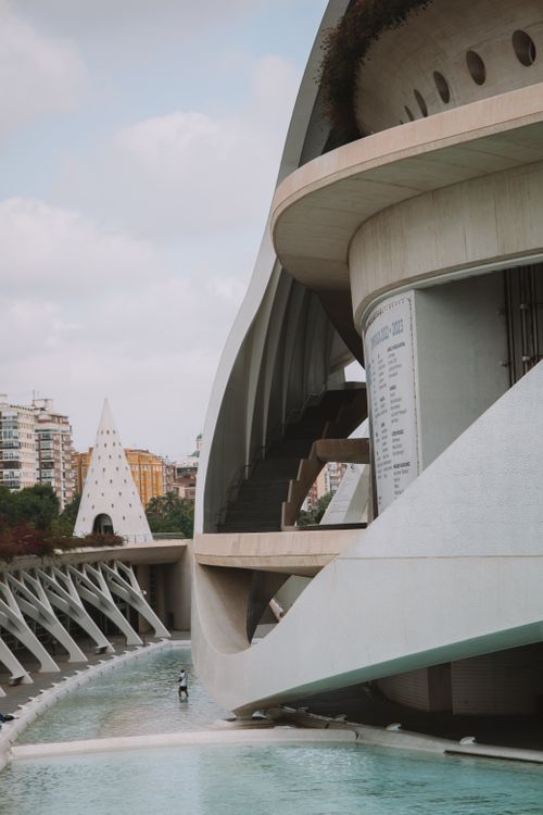 Free Futuristic architecture of Palau de les Arts in Valencia, Spain with water features and urban skyline. Stock Photo