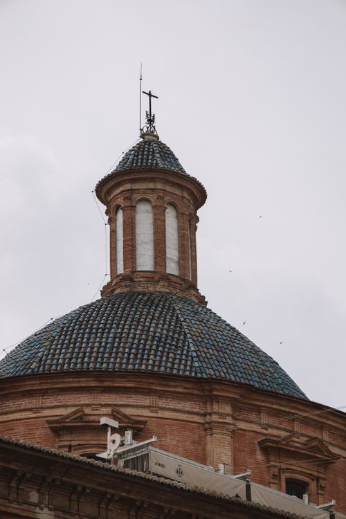 Free Detailed view of baroque church dome in Valencia, Spain, a popular tourism and architectural landmark. Stock Photo