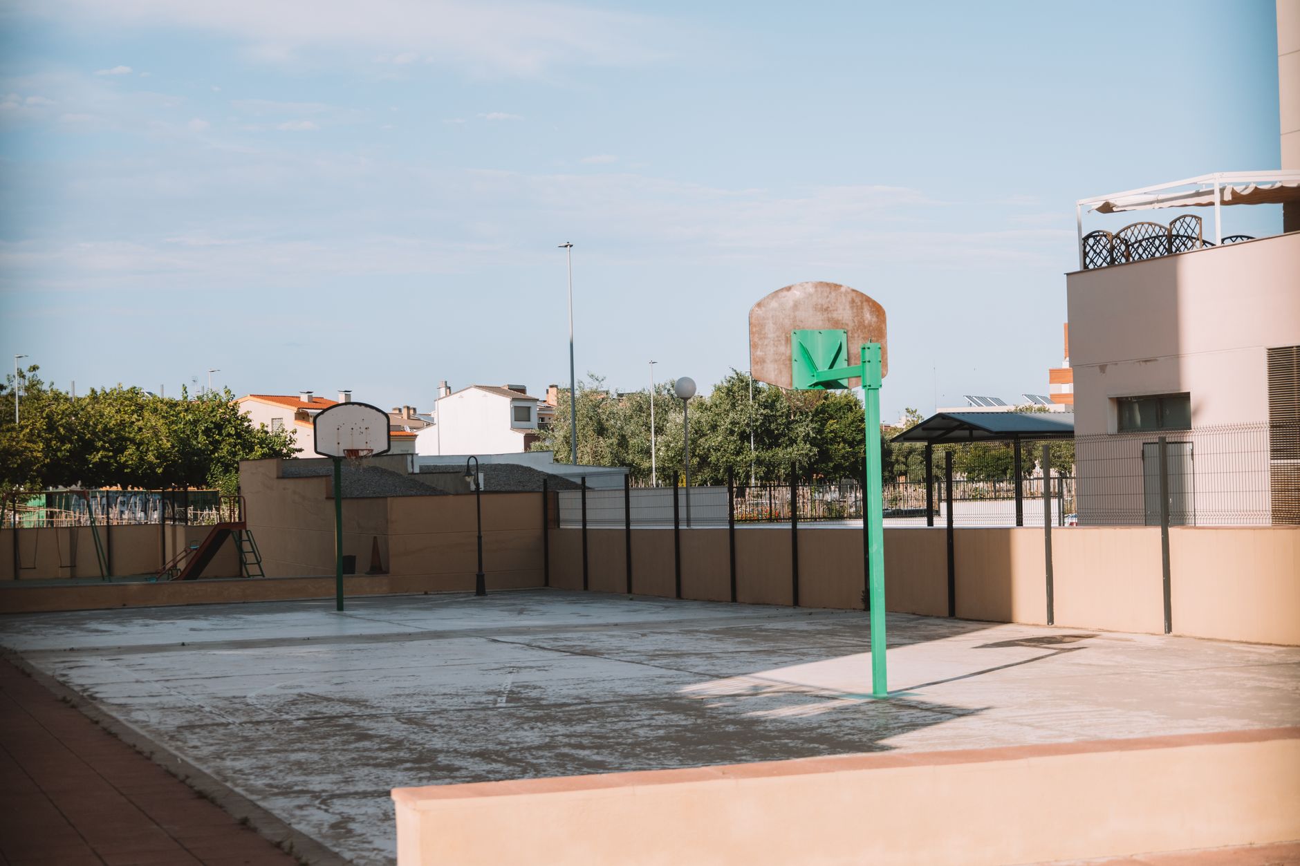 Empty basketball court in a residential outdoor area of Valencia, Spain.