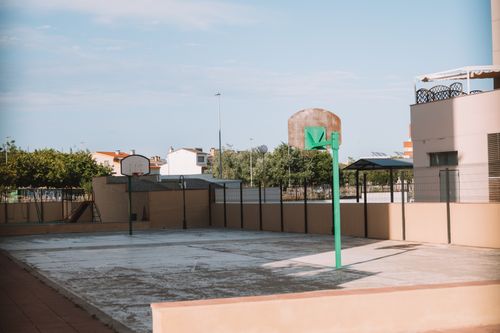 Free Empty basketball court in a residential outdoor area of Valencia, Spain. Stock Photo