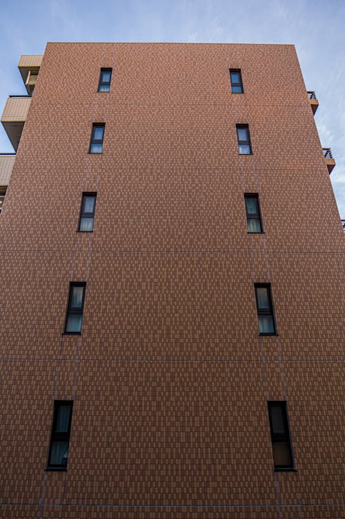 Tall Orange Apartment with Small Windows