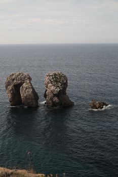 Majestic cliffs and ocean waters at Liencres, showcasing Cantabria's natural beauty.