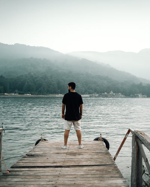 A Man Standing on a Pier 