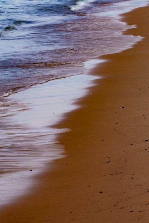 Close-up of Waves Washing up the Beach 