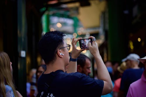 A man taking a picture of a crowd of people