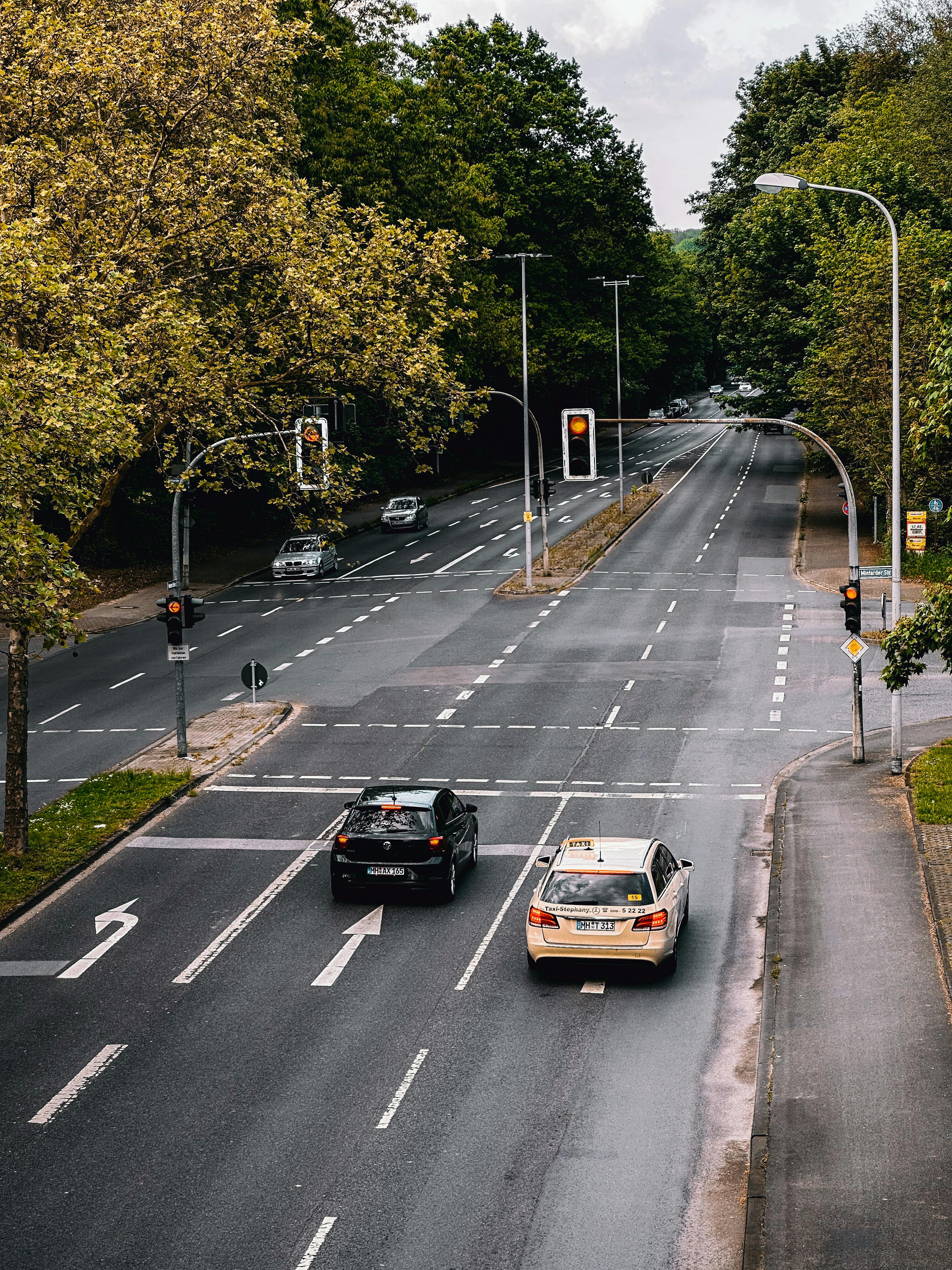 Aerial photograph of a city intersection surrounded by trees in Germany.