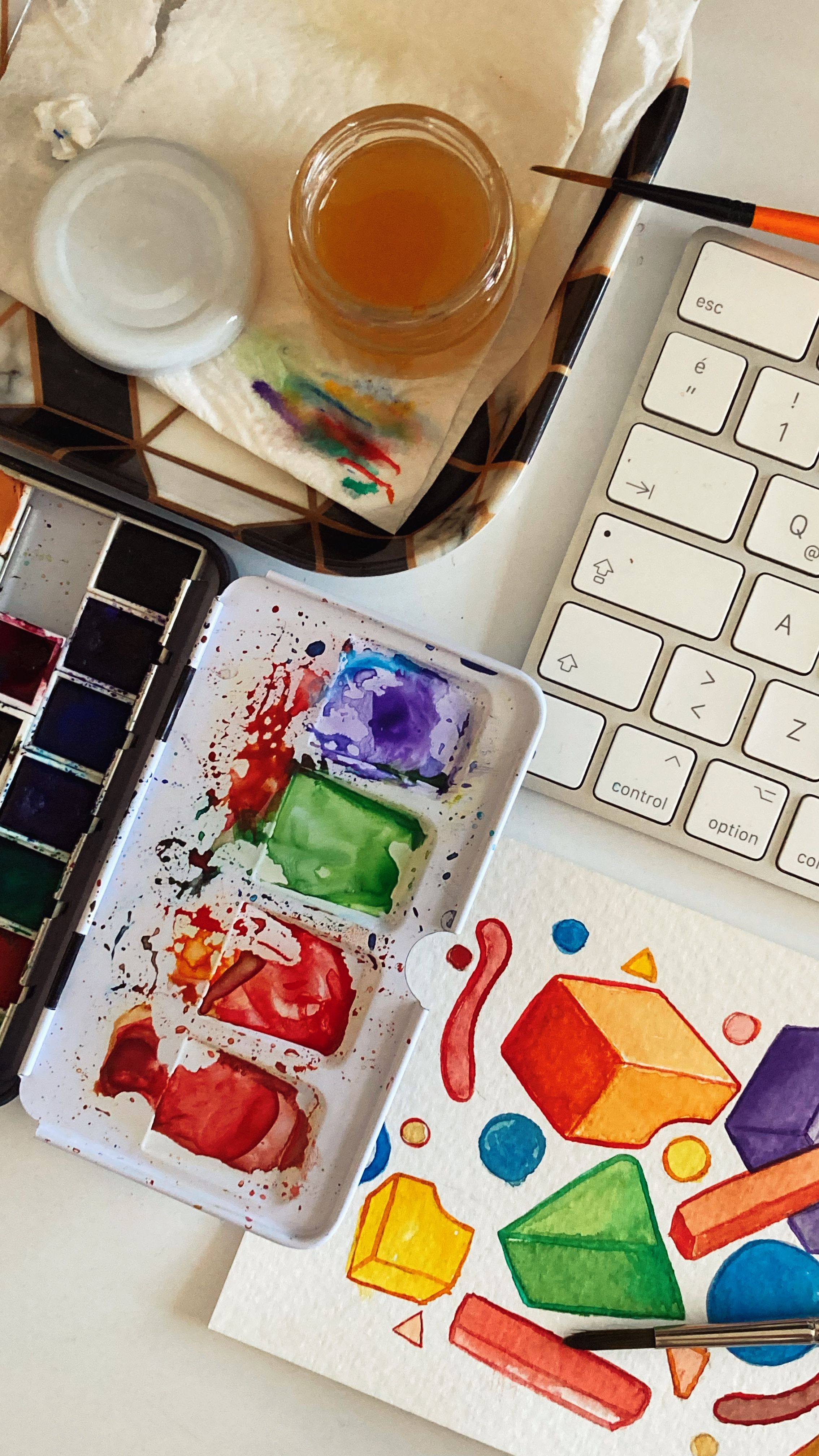 Colorful Paints near Keyboard · Free Stock Photo
