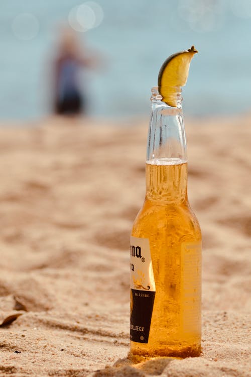 Free Corona Beer Bottle Across Sands Stock Photo