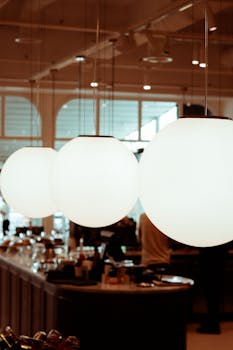 Elegant round lamps softly illuminating a modern restaurant interior in Ankara, Türkiye.