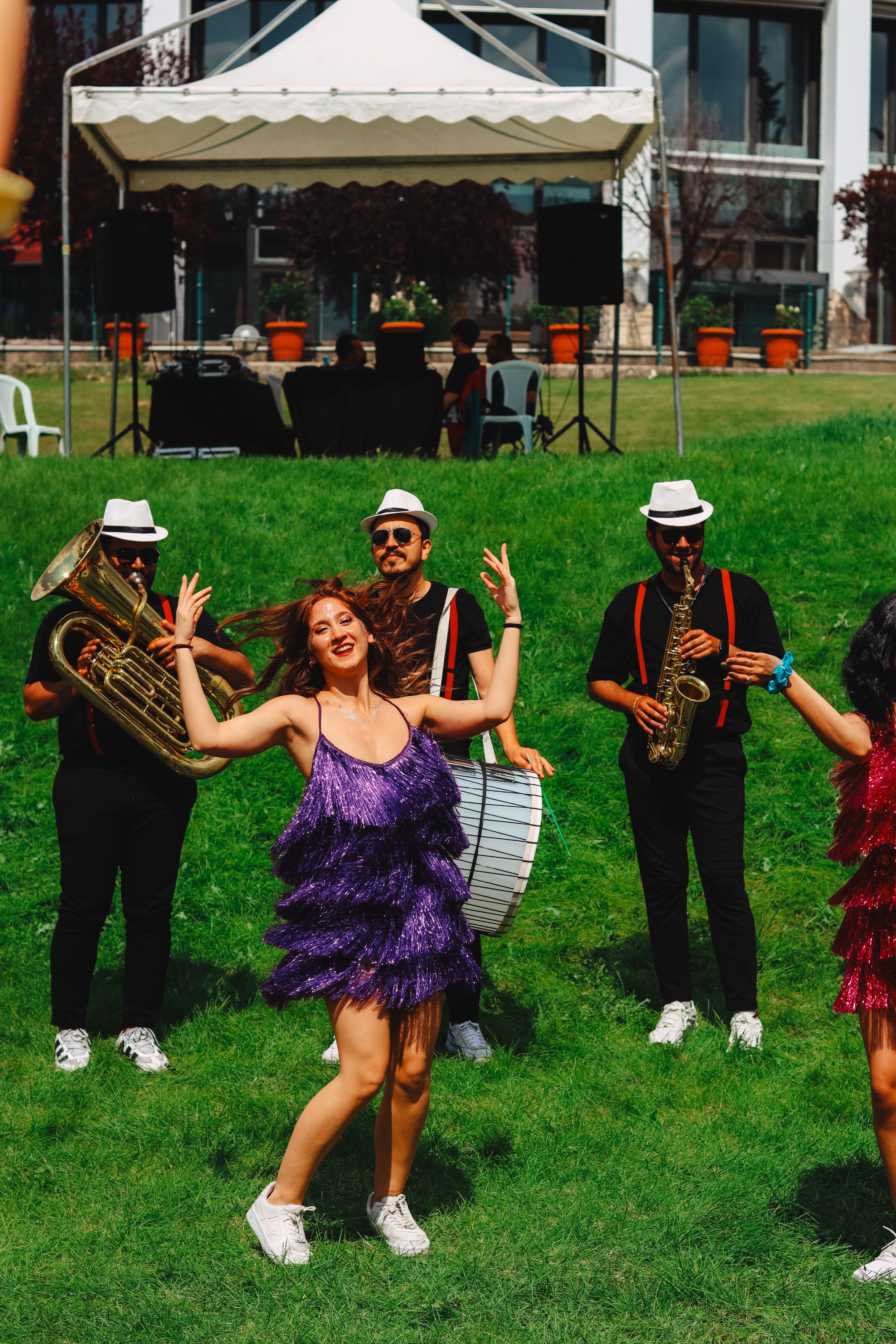 Vibrant outdoor concert with musicians and dancers in Ankara, Türkiye.