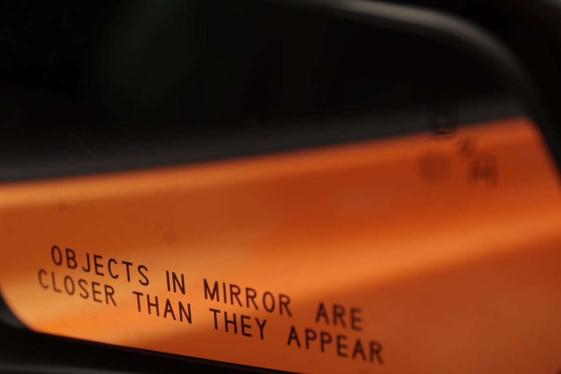 Objects in mirror are closer than they appear · Free Stock Photo