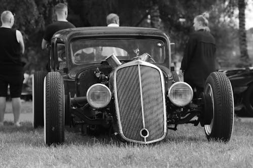 Black and white photo of a hot rod car