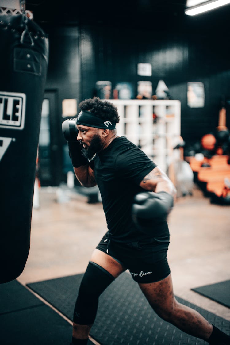 Man Training Box At The Gym 