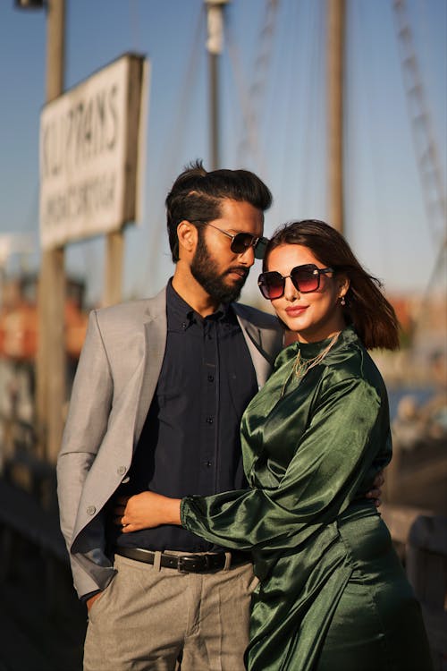 Young Elegant Couple Posing in the Harbor 