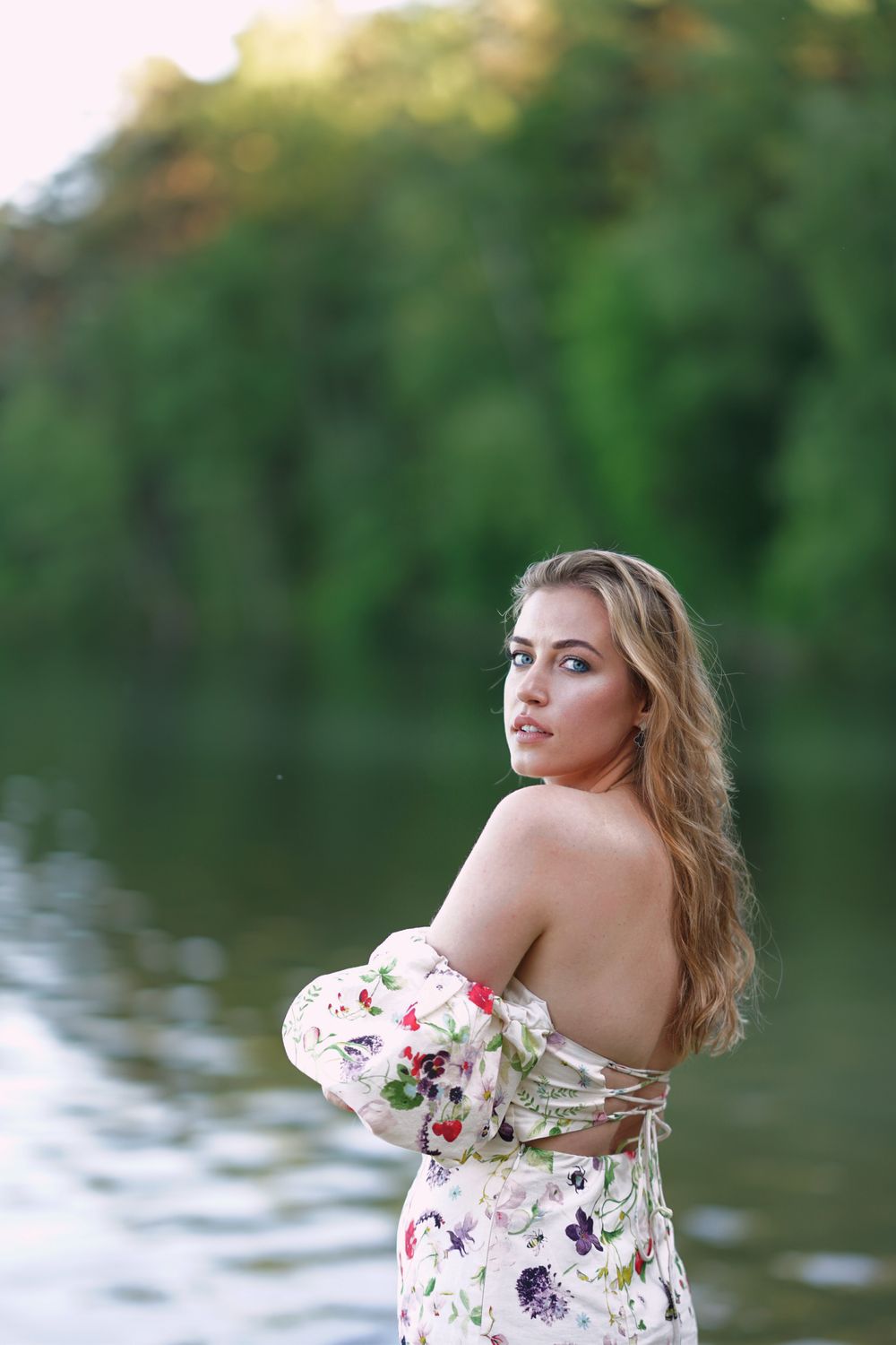 Woman in a Dress Standing by the Water · Free Stock Photo