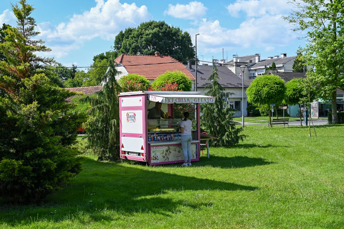 An Ice Cream Booth in a Park 