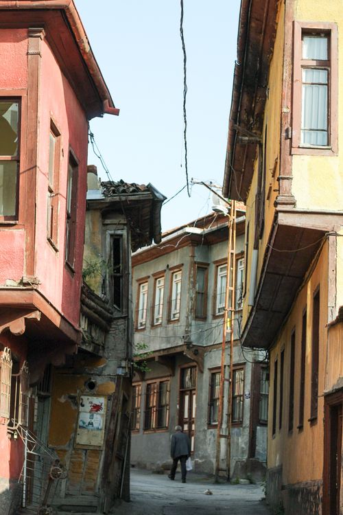 Free Explore a picturesque alley in a historic old town with vibrant, colorful architecture. Stock Photo