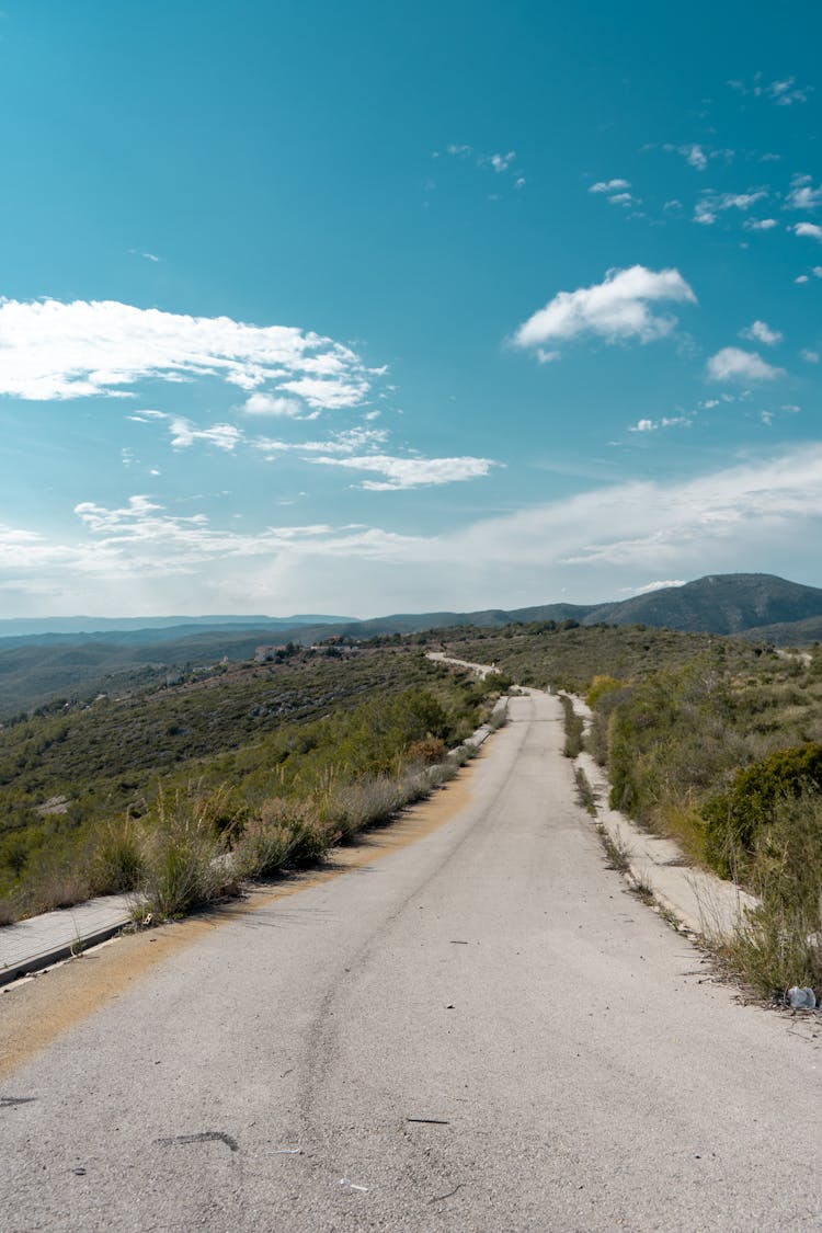 Sunlit Road On Hill