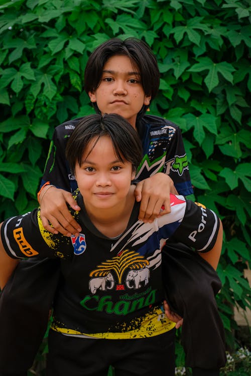 Boy Carrying other Boy Piggyback