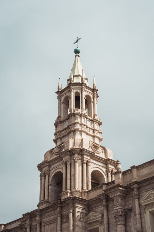 Free Stunning shot of the Basilica Cathedral bell tower against a clear sky in Arequipa, Peru. Stock Photo