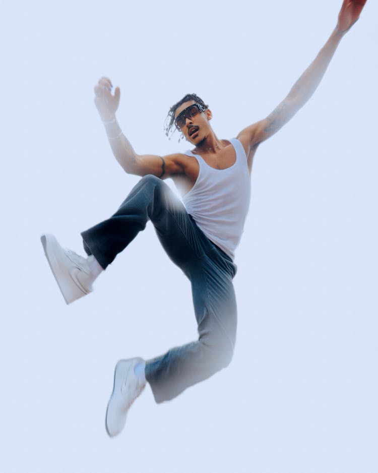 Man In Sunglasses Jumping In Air