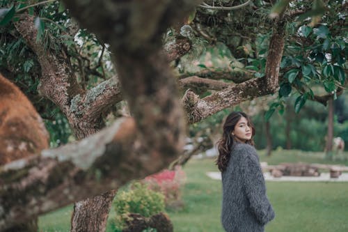 Woman in Sweater Posing in Park