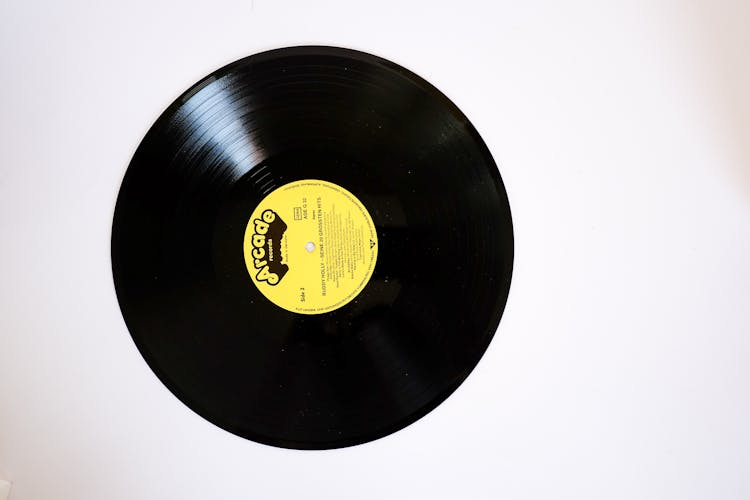 Retro Phonorecord With Yellow Label On White Background