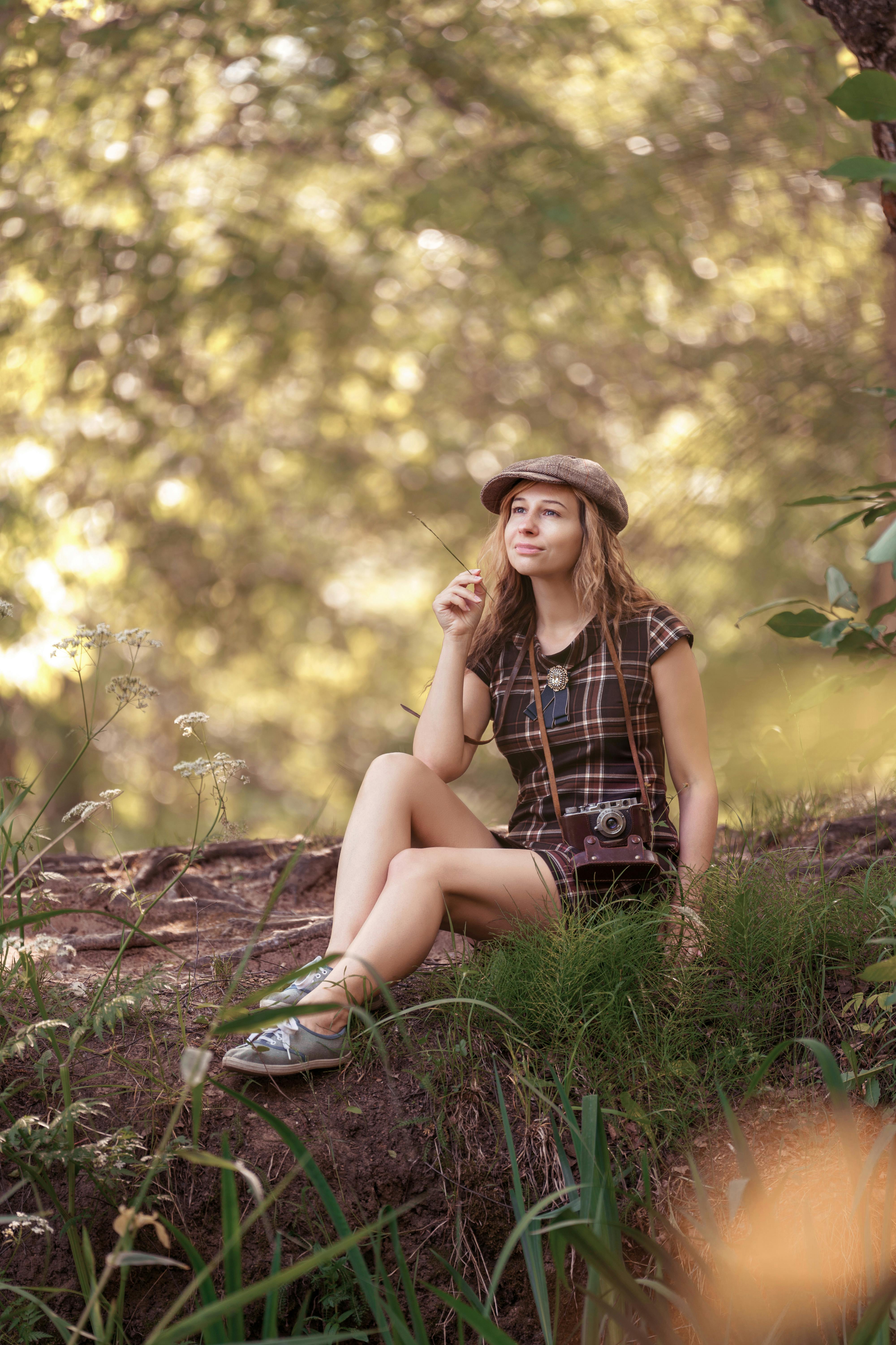 Woman Sitting and Posing in Forest · Free Stock Photo