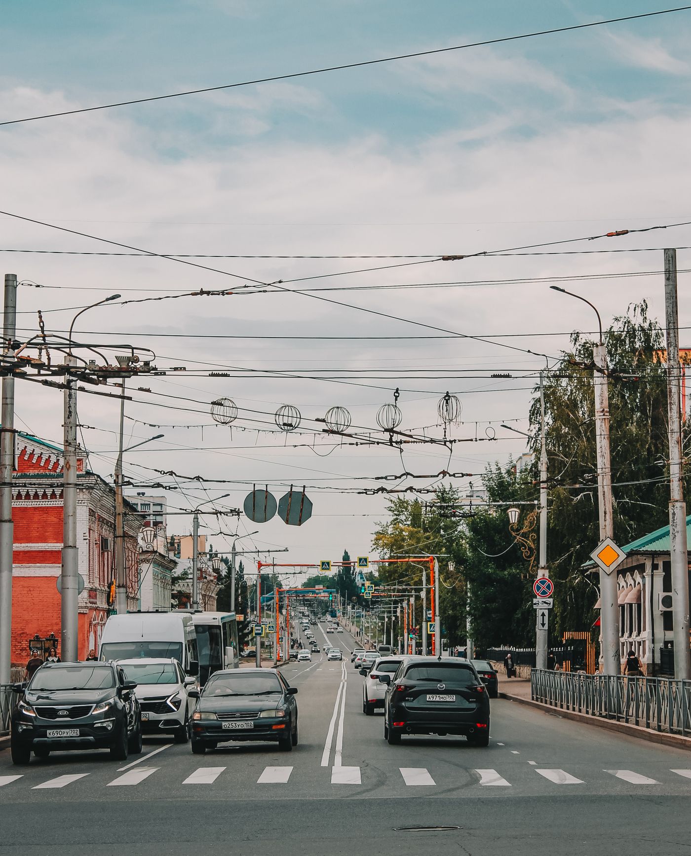 Busy urban road intersection with crosswalks and traffic infrastructure