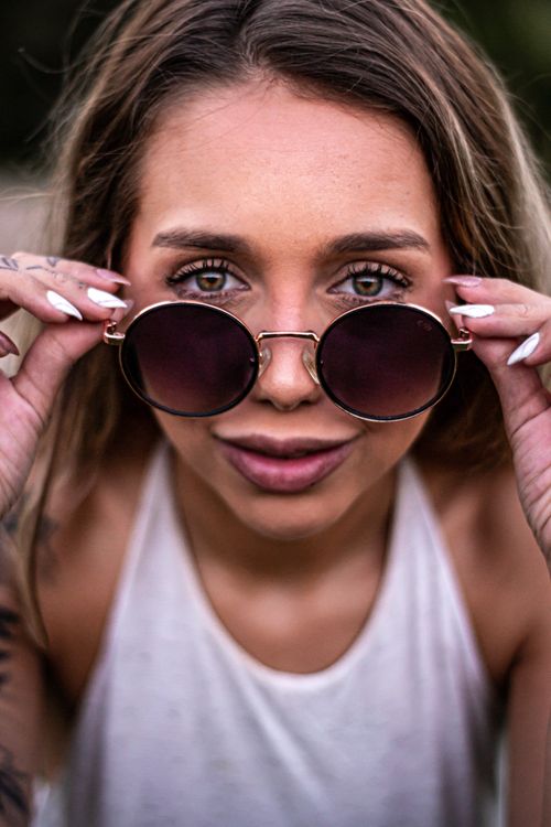 Look Over Spectacles Woman Looking over Glasses · Free Stock Photo