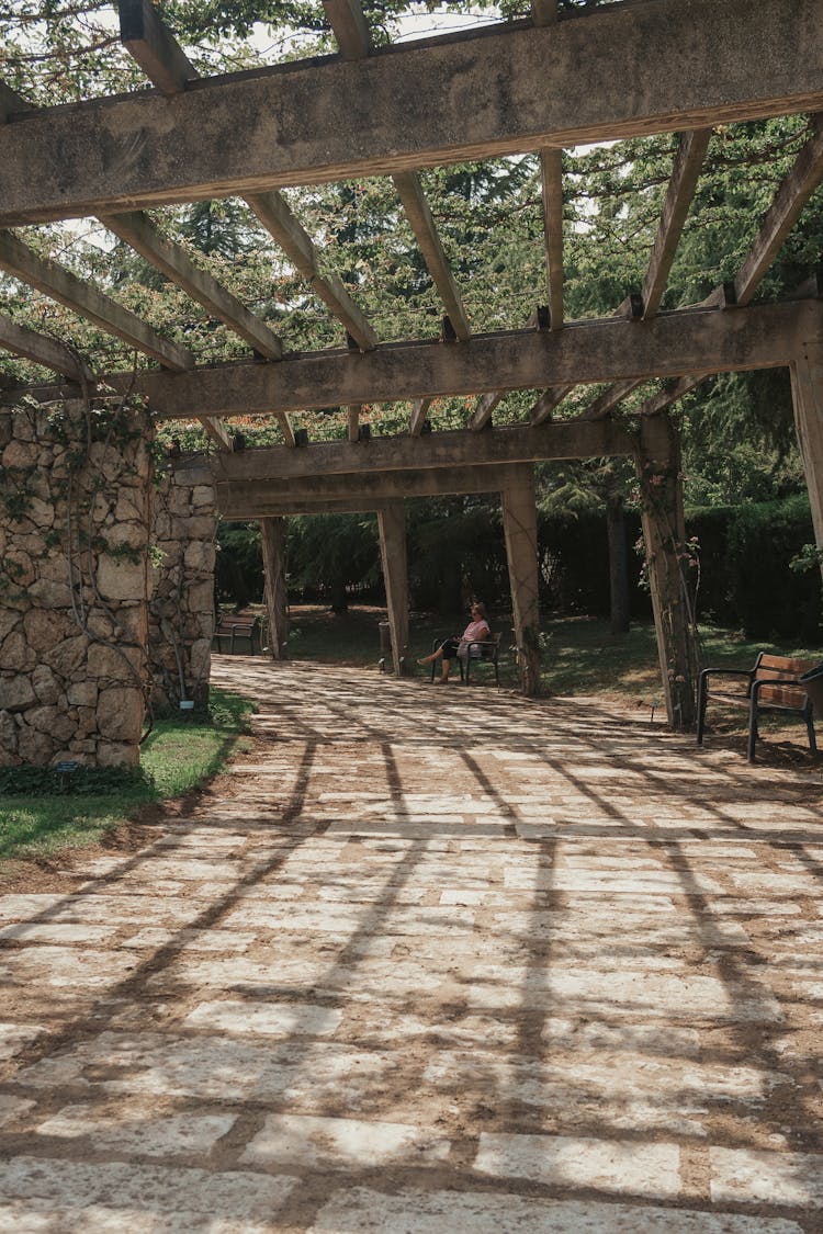 Stone Beams Over Pavement In Park