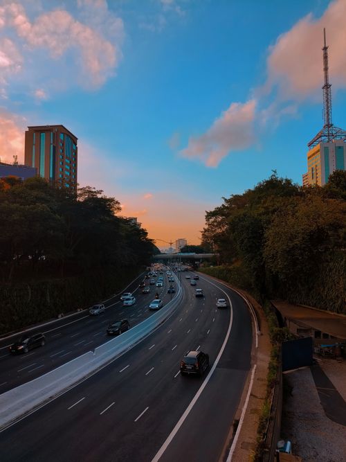 Free Aerial view of a bustling highway in São Paulo at sunset showcasing urban life. Stock Photo