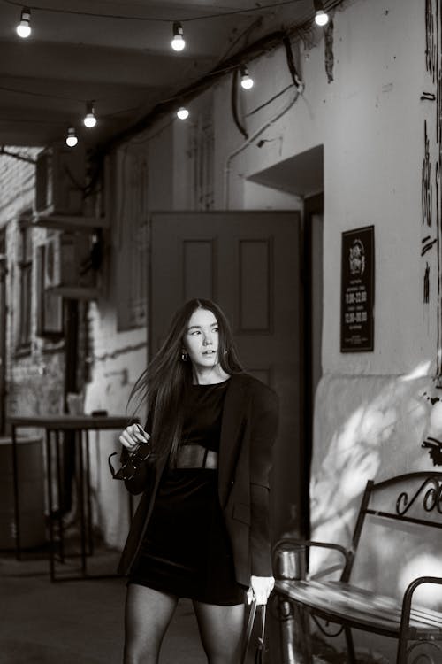 Woman Posing with Door behind in Black and White