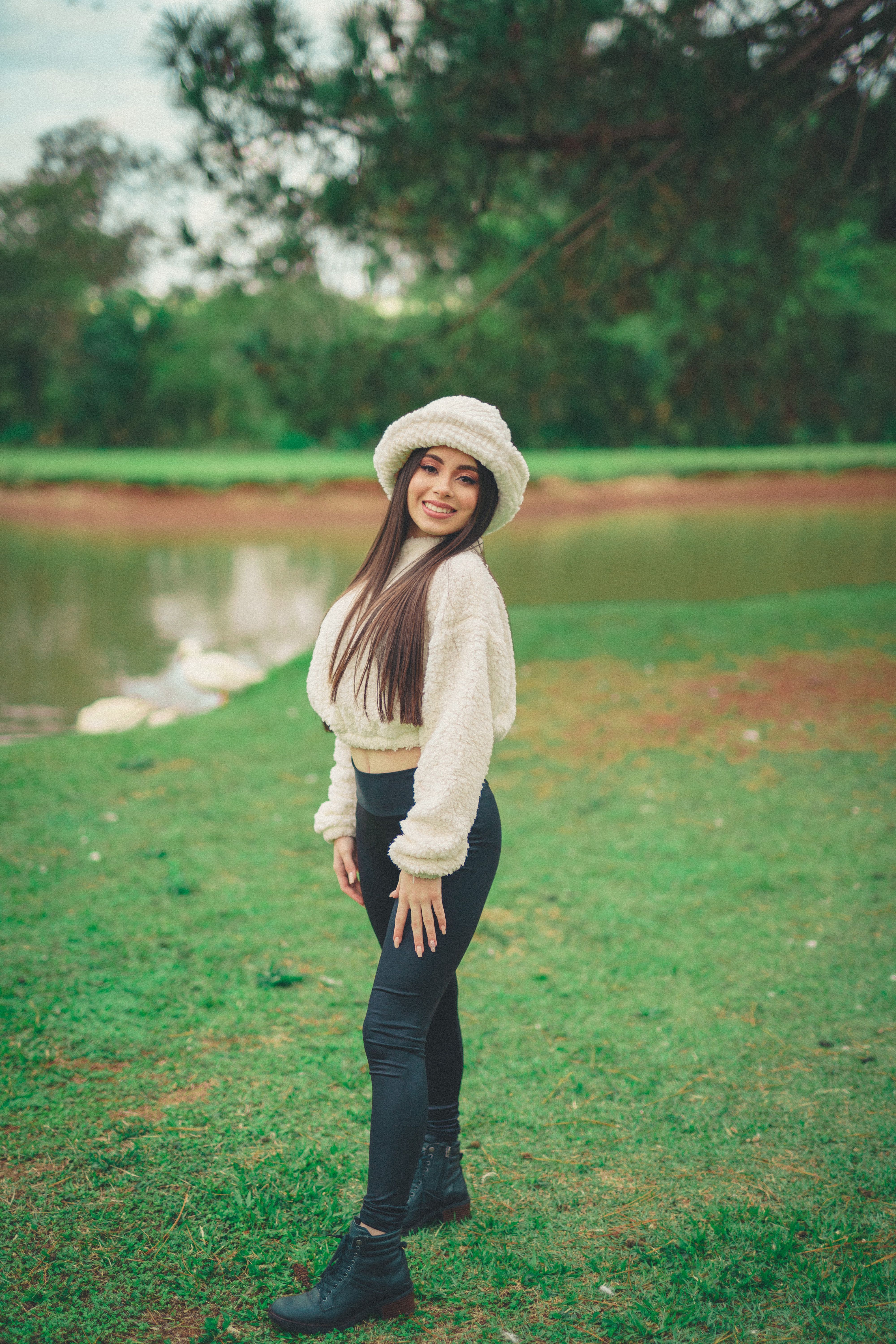Smiling Woman Posing on Grass · Free Stock Photo