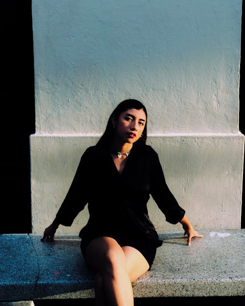 Woman Sitting and Posing on Bench