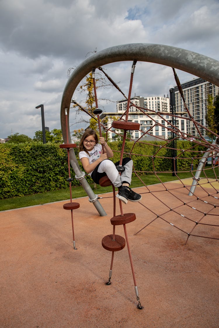 Child Playing In The Playground