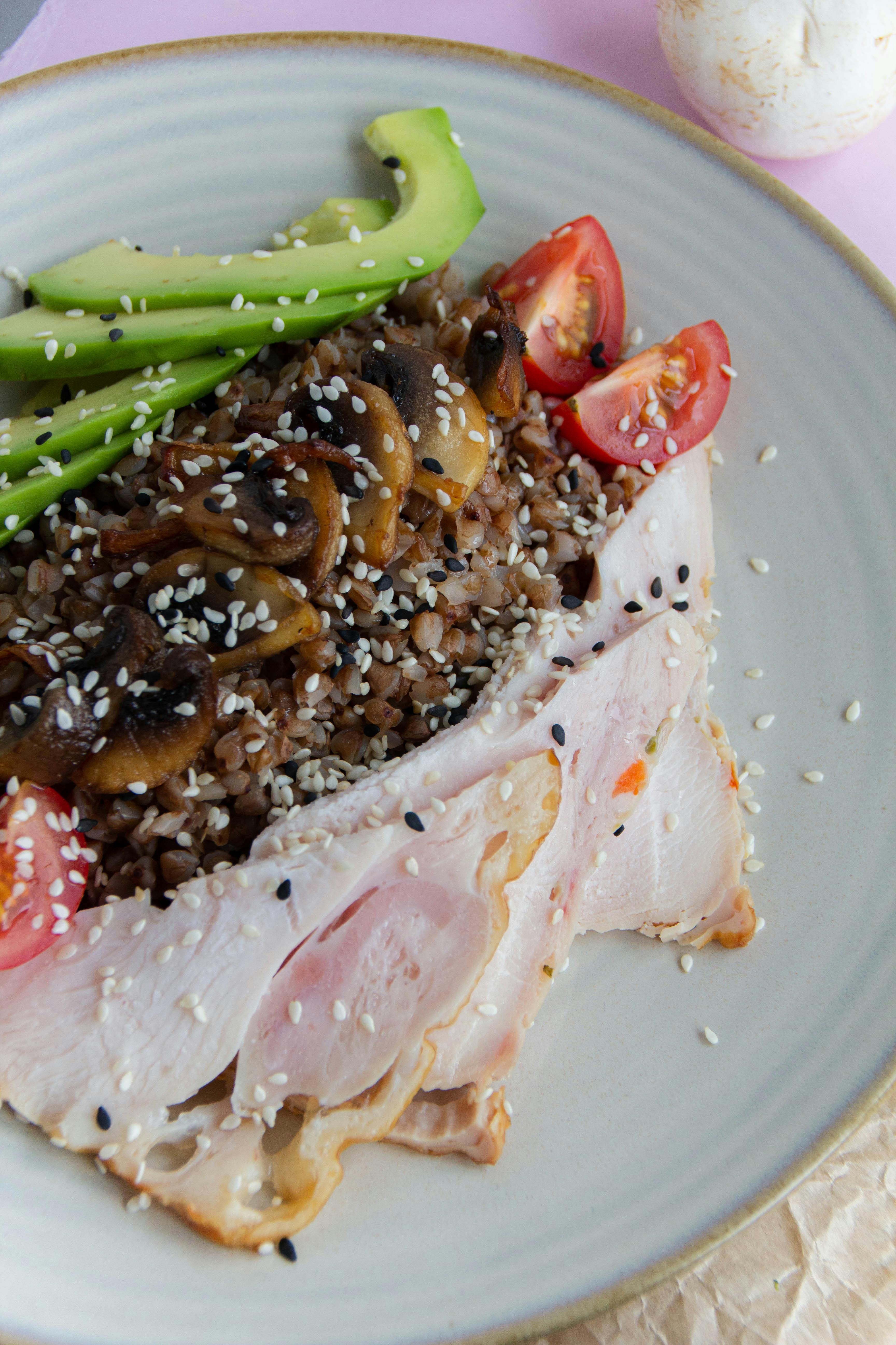 closeup of a dish with meat vegetables and mushrooms
