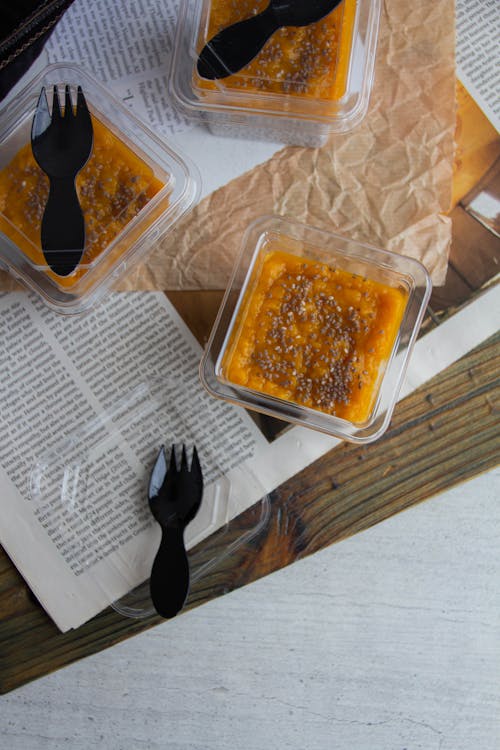 Top View of a Yellow Fruit Mousse Dessert on a Newspaper