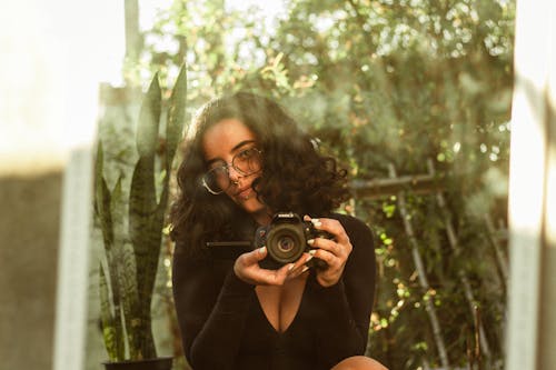 Brunette Woman with Camera in Mirror