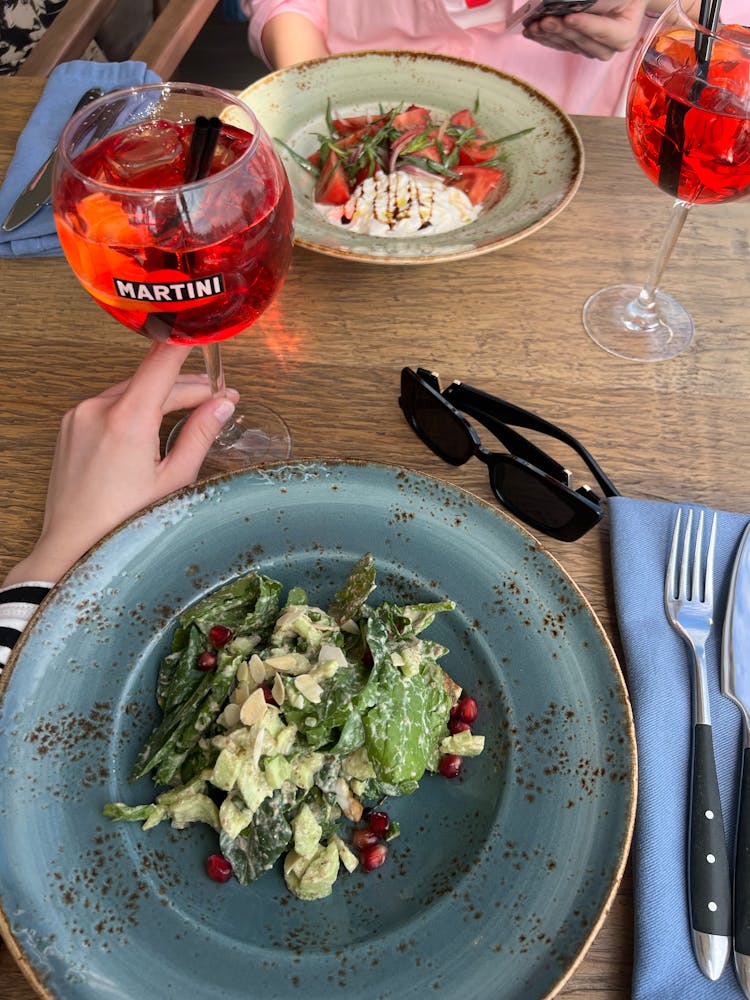 Plates With Salads At Restaurant