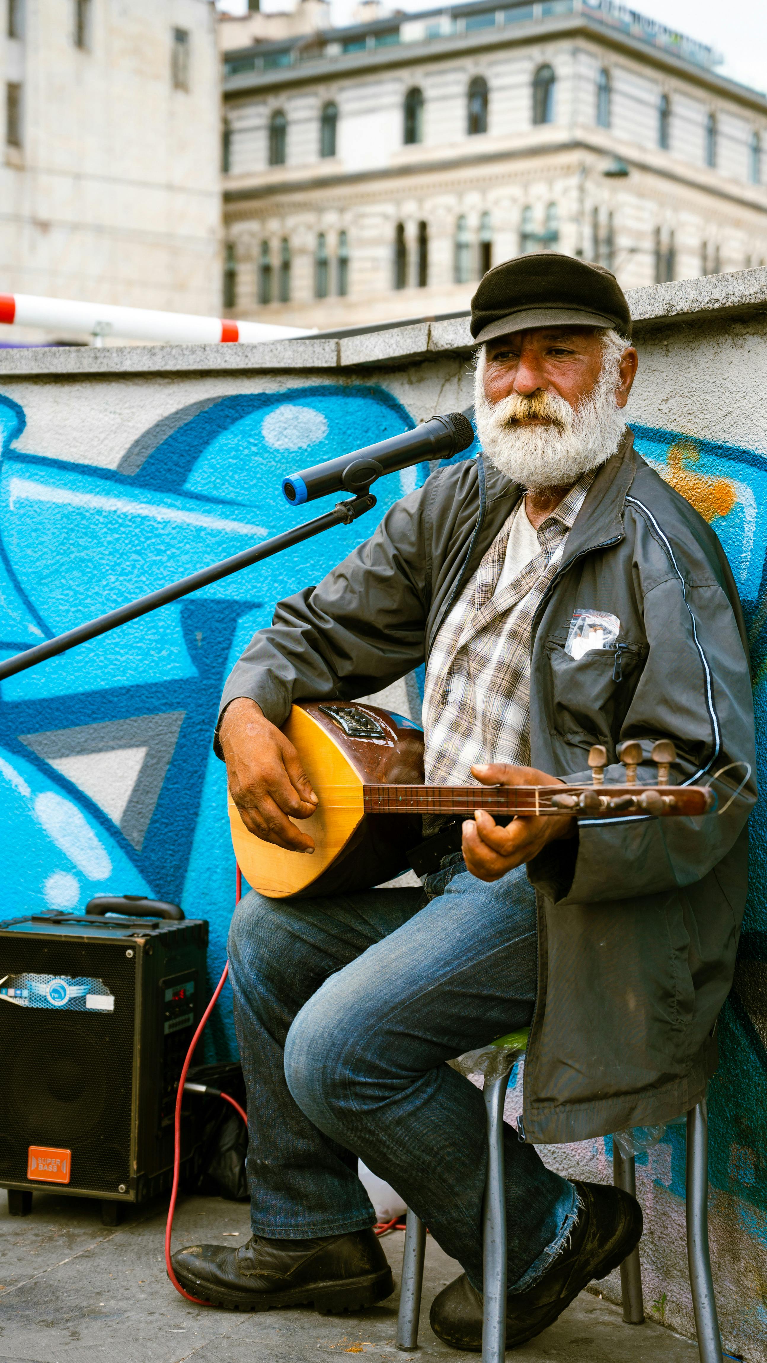 Elderly Man Playing on Banjo Free Stock Photo