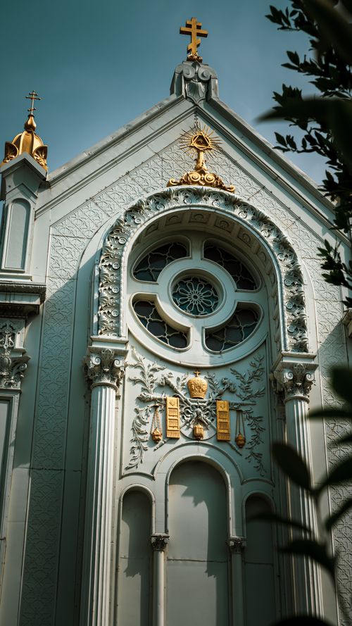 Free A beautifully ornamented orthodox church facade featuring intricate religious symbols and architectural details. Stock Photo
