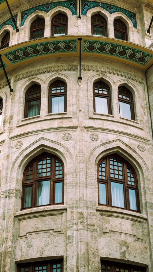 Free Close-up of an ornate Ottoman architectural facade with arched windows in Istanbul. Stock Photo
