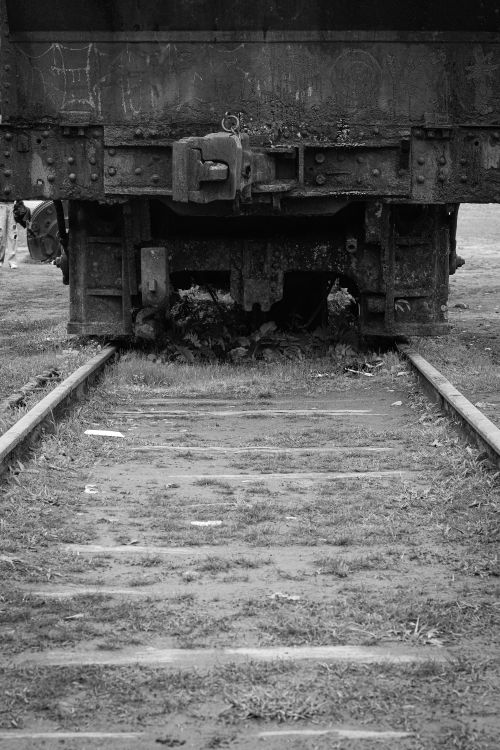 Free Black and white photo of an old rusty freight car on rail tracks in São Paulo, Brazil. Stock Photo