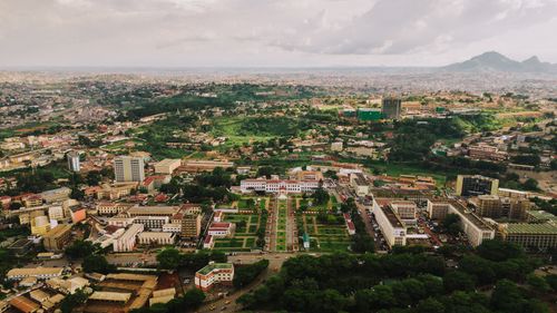 Free Aerial view of lush Yaoundé cityscape showcasing urban and green landscapes. Stock Photo