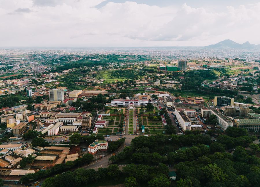 Stunning aerial view of Yaoundé cityscape with green landscapes and urban architecture.