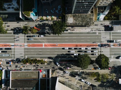 Free Aerial shot of Avenida Paulista in São Paulo showing bustling city life and traffic. Stock Photo