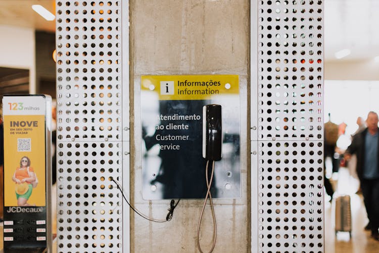 Telephone Headset Hanging On Wall In Airport