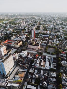 Stunning aerial view of Manaus cityscape featuring the iconic Teatro Amazonas and urban skyline.